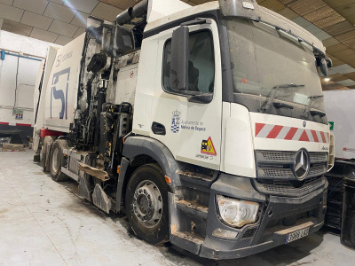 Tall slender porcelain bottle with natural clay textured body and cork stopper.