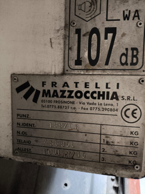 Tall slender porcelain bottle with natural clay textured body and cork stopper.