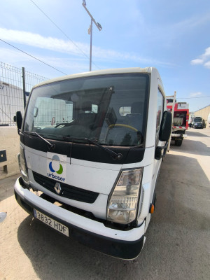 Tall slender porcelain bottle with natural clay textured body and cork stopper.